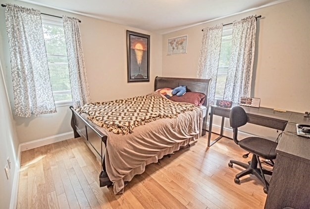 492 Cotuit Road Mashpee, MA 02649 - Photo 7 of 13 a bed room with a bed and a chair