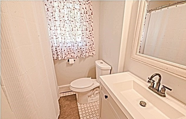 492 Cotuit Road Mashpee, MA 02649 - Photo 9 of 13 a bathroom with a sink toilet and shower