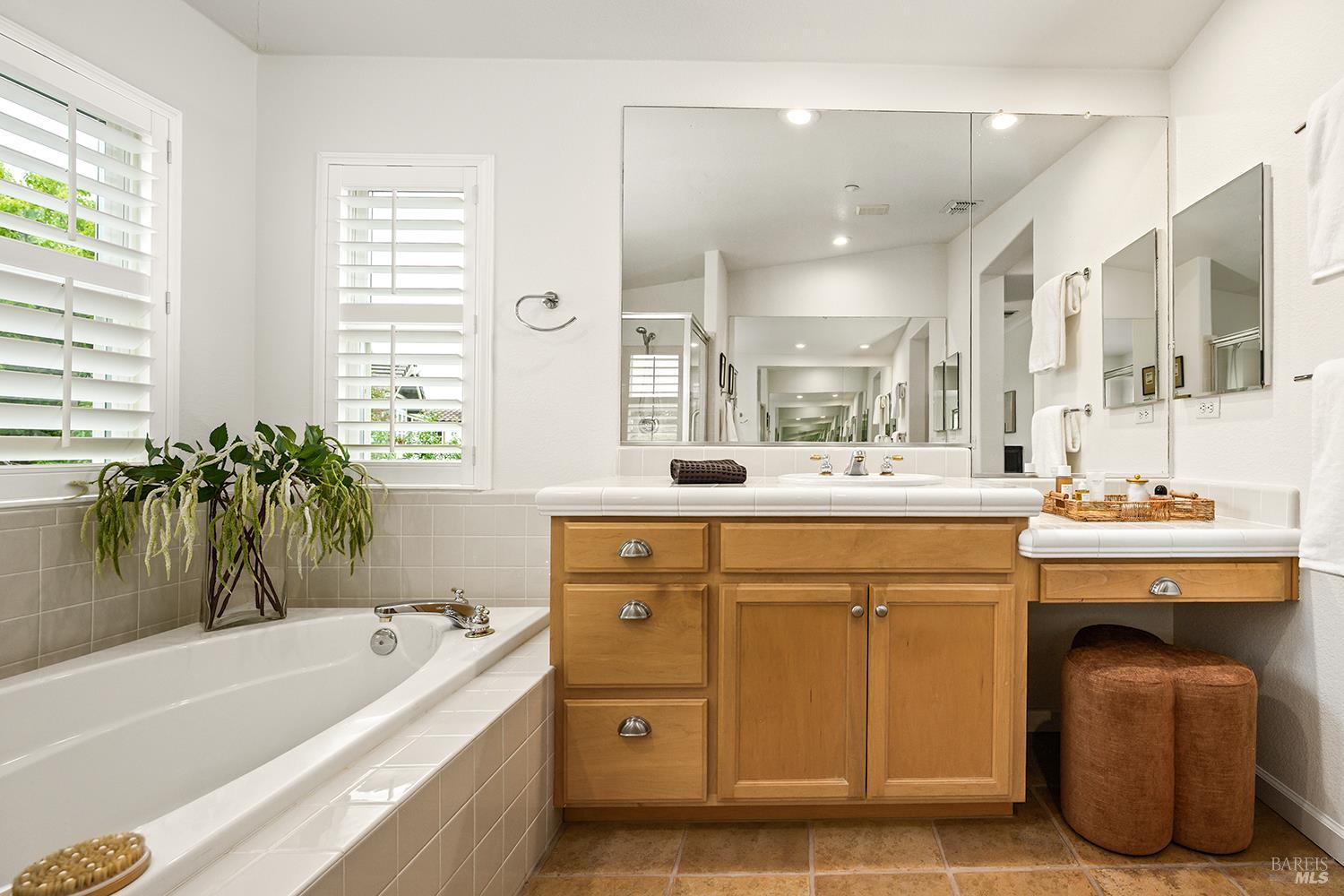 38 Maybeck Street Novato, CA 94949 - Photo 33 of 47 a spacious bathroom with a tub sink and mirror