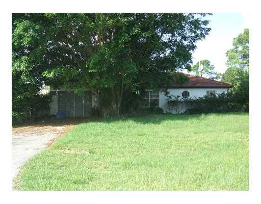 2120 Southwest Vista Road Port St. Lucie, FL 34953 - Photo 1 of 3 a view of a backyard with a garden