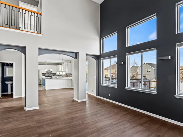 a view of an entryway and livingroom with wooden floor