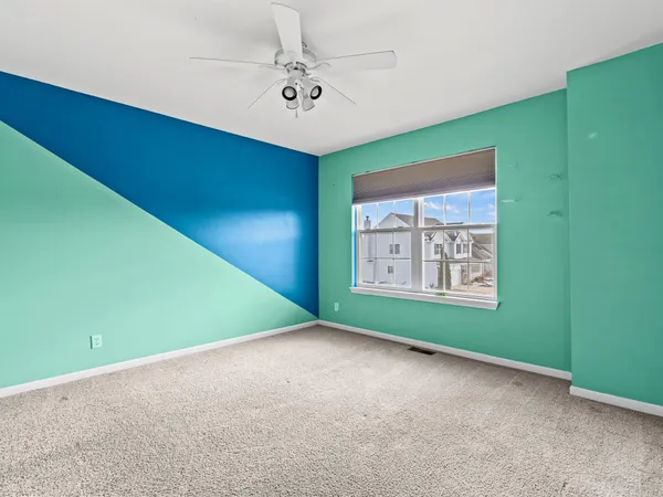 a view of a room with a window and a projector