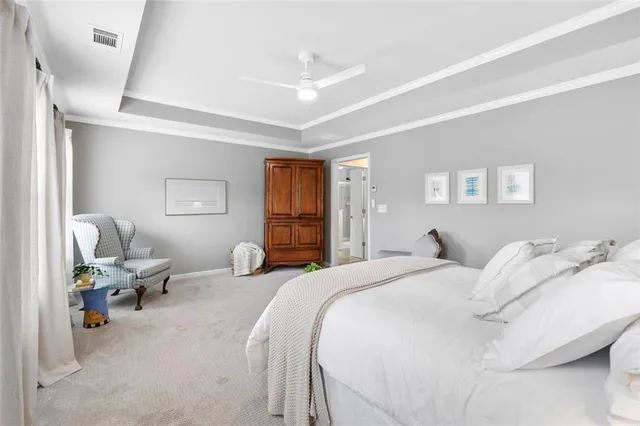 a bedroom with a bed and a couch