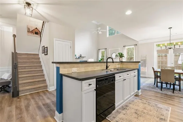 a spacious bathroom with a granite countertop sink and a mirror