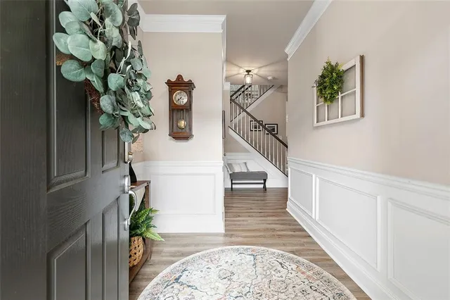 a view of entryway with paintings on the wall