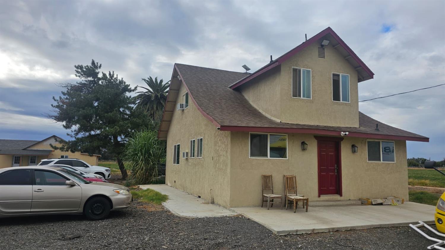 a front view of a house with parking space