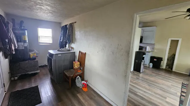 a view of a livingroom with furniture and a flat screen tv