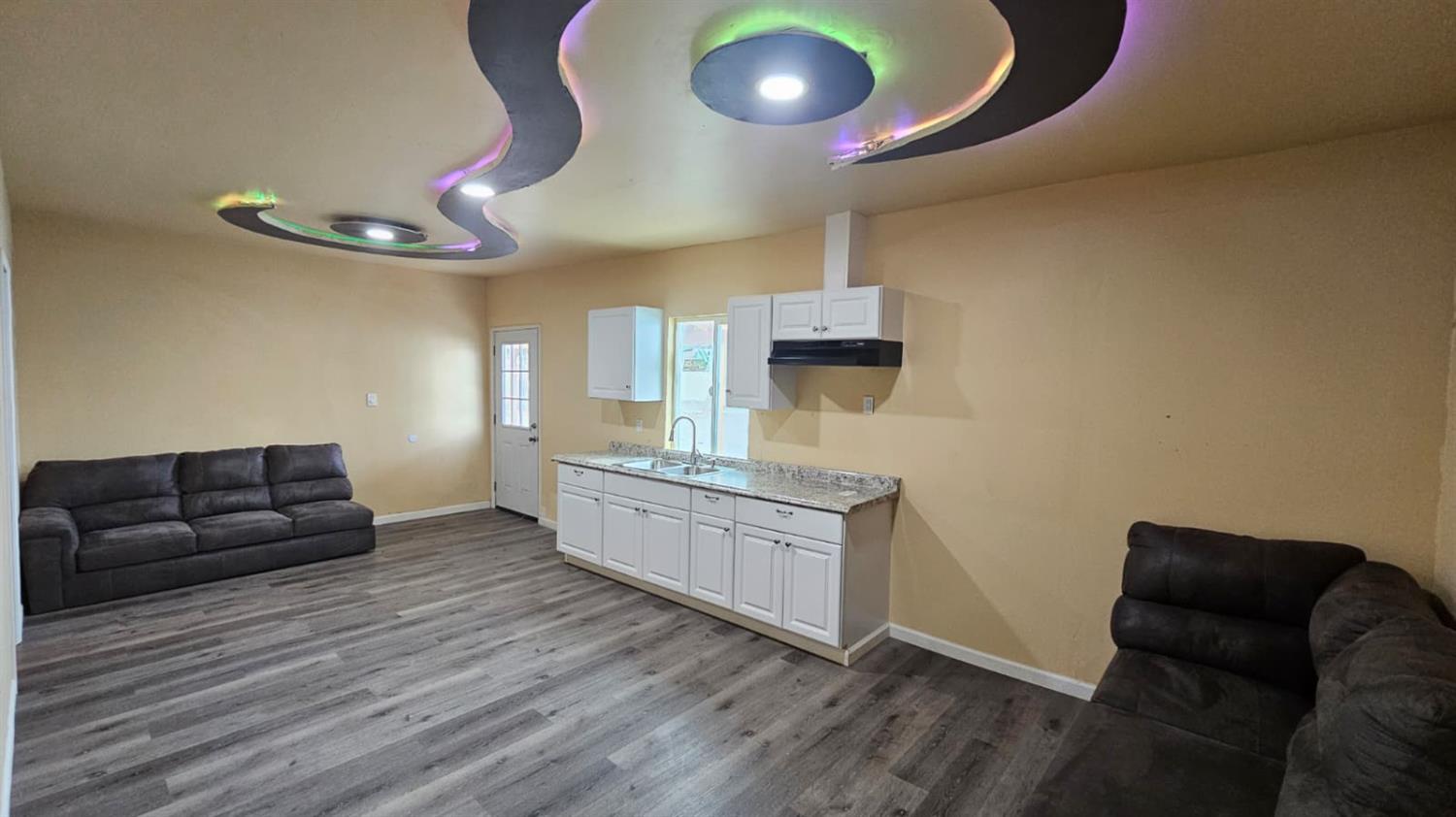 11881 Griffith Road Turlock, CA 95380 - Photo 24 of 42 a living room with furniture and wooden floor
