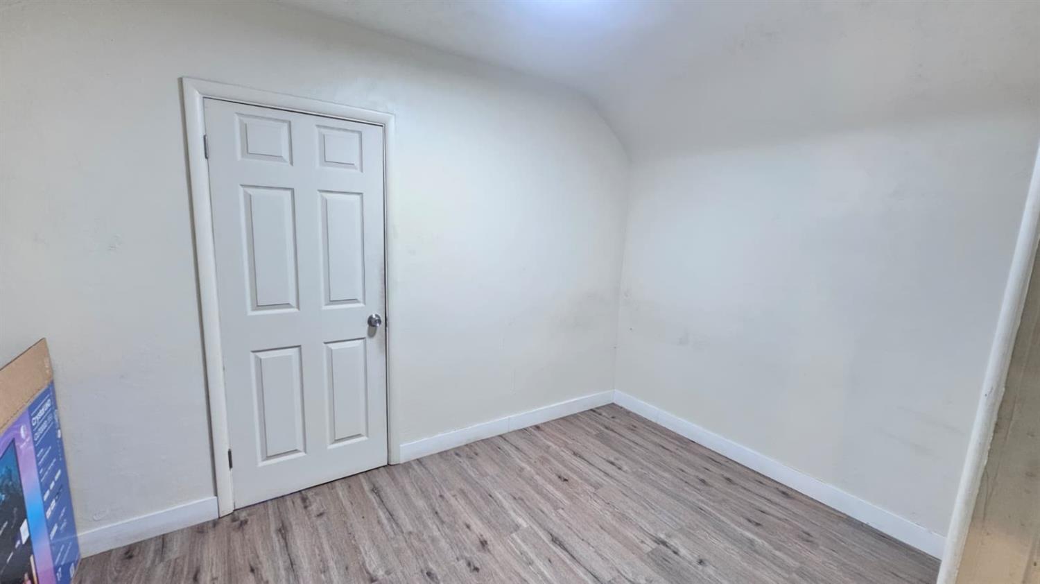 11881 Griffith Road Turlock, CA 95380 - Photo 8 of 42 a view of an empty room with wooden floor