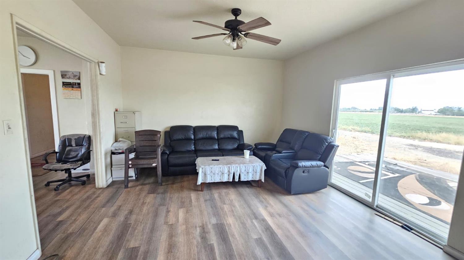 11881 Griffith Road Turlock, CA 95380 - Photo 9 of 42 a living room with furniture and a large window