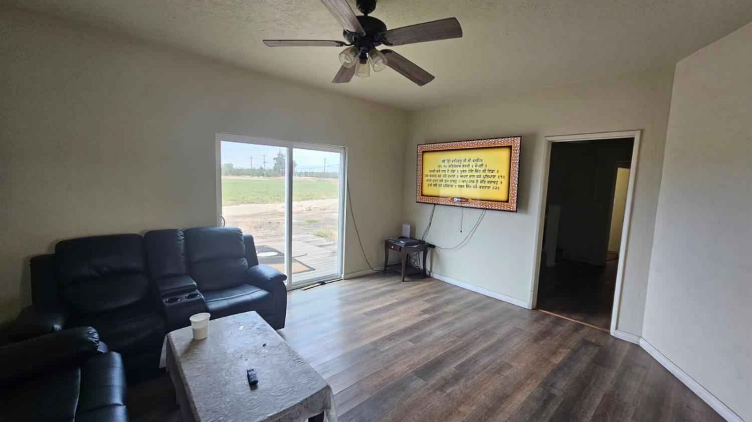 11881 Griffith Road Turlock, CA 95380 - Photo 10 of 42 a living room with furniture and wooden floor