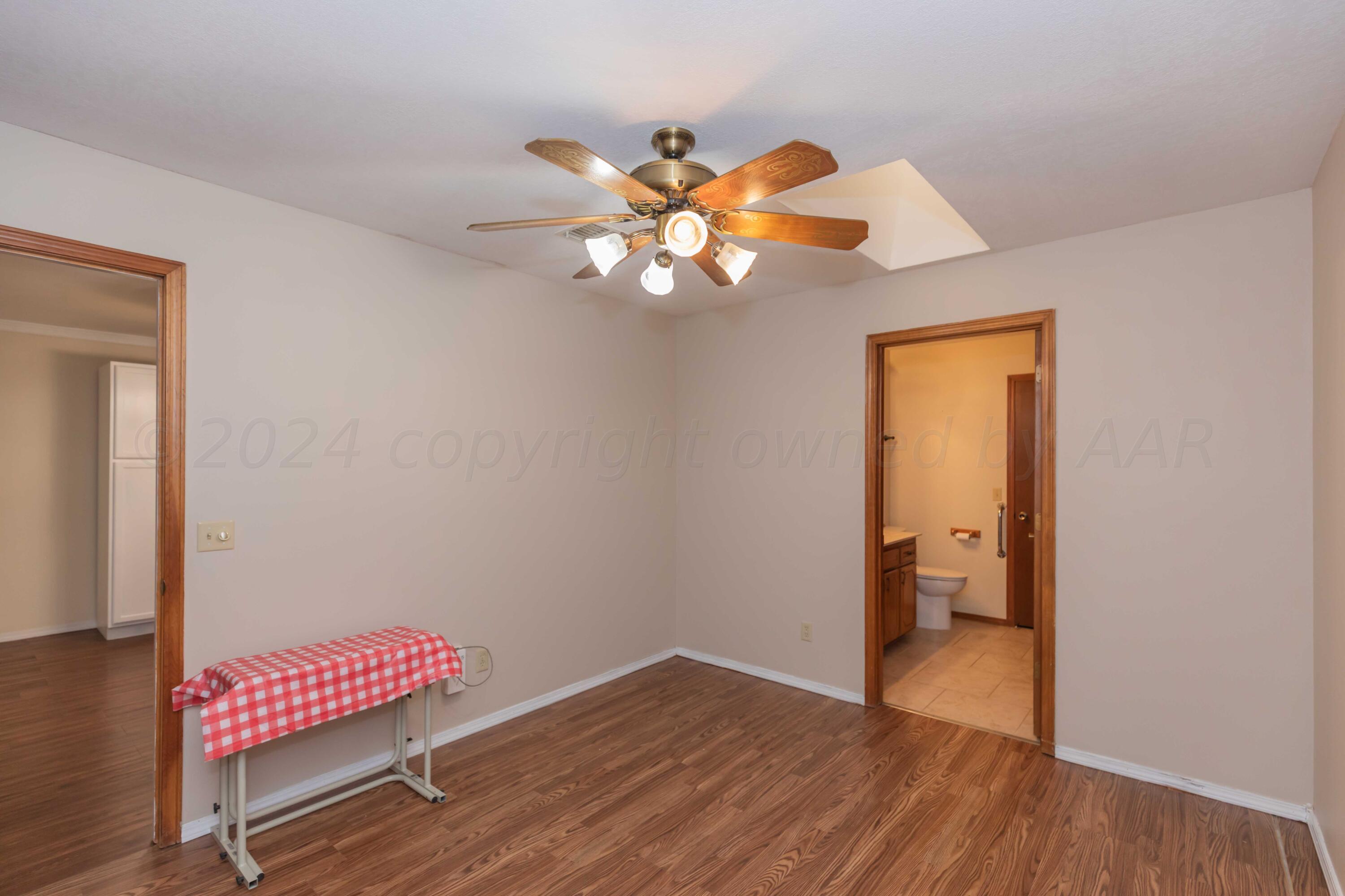 3406 Gladstone Lane Amarillo, TX 79121 - Photo 27 of 35 a view of a room with wooden floor and closet