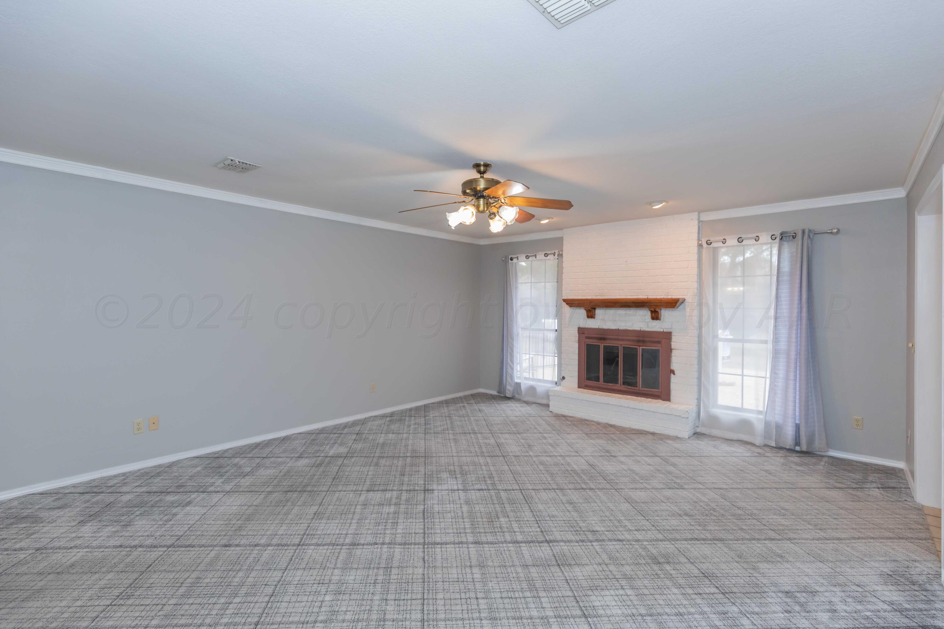 3406 Gladstone Lane Amarillo, TX 79121 - Photo 4 of 35 a view of a livingroom with a fireplace