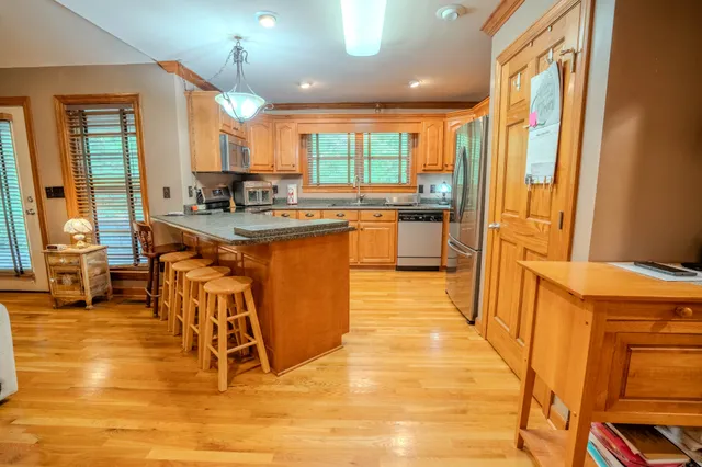 a living room with fireplace furniture and a flat screen tv