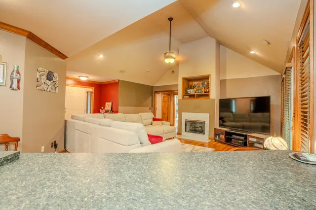 a bedroom with bed and a large window