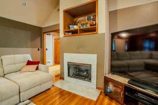 a bedroom with a bed and flat screen tv