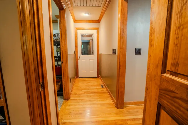 a bathroom with granite countertop double vanity and a mirror