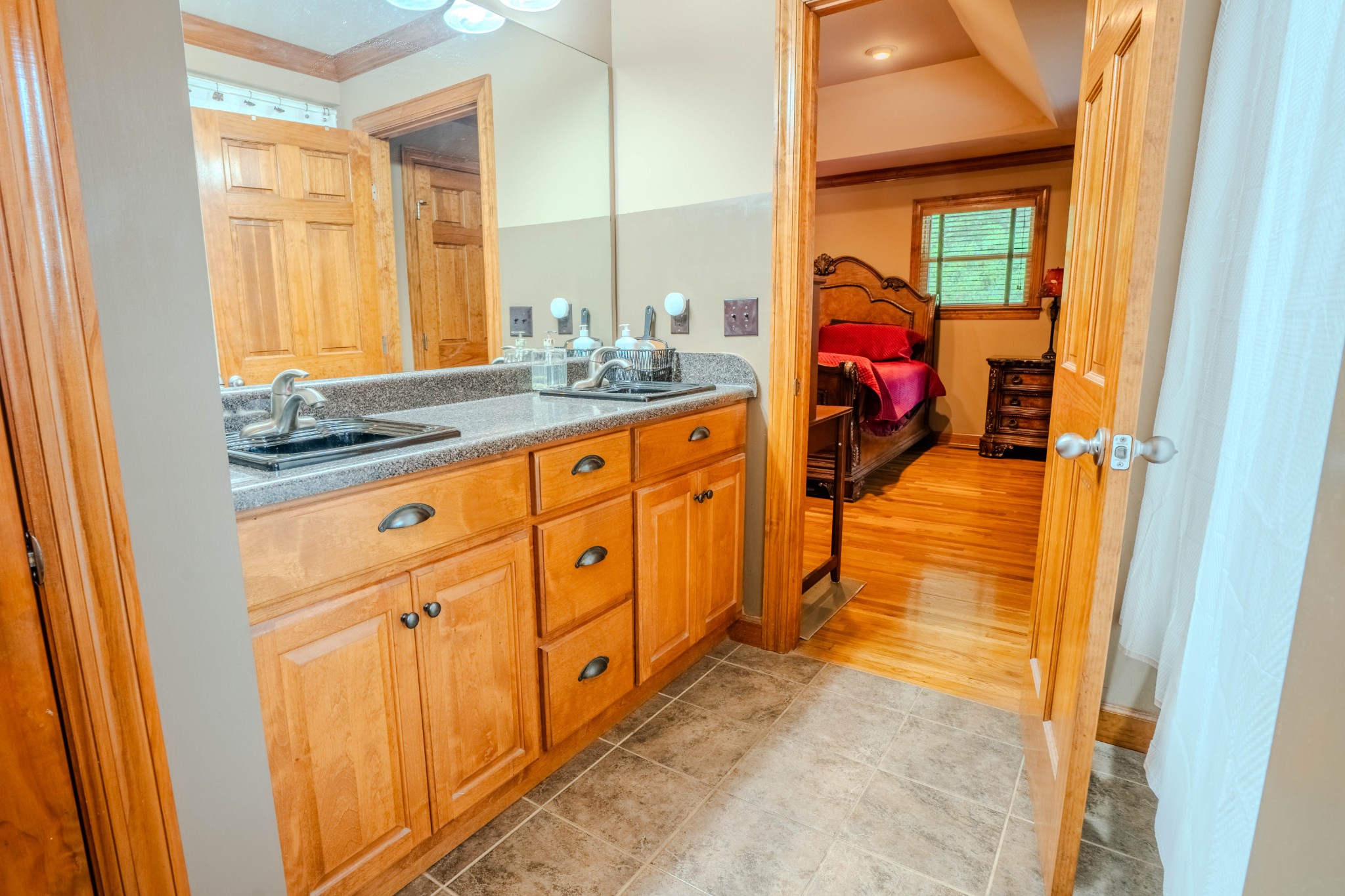 410 Britton Hollow Road Pulaski, TN 38478 - Photo 31 of 74 a bathroom with granite countertop double vanity and a mirror