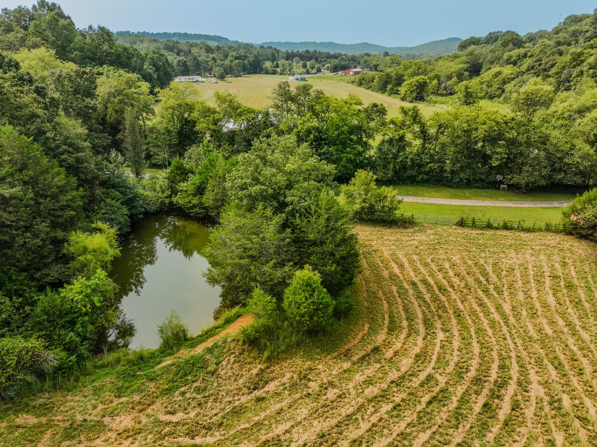 410 Britton Hollow Road Pulaski, TN 38478 - Photo 70 of 74 a view of a lake with a yard