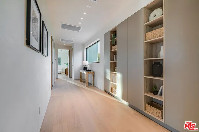 a bedroom with a bed and lamp