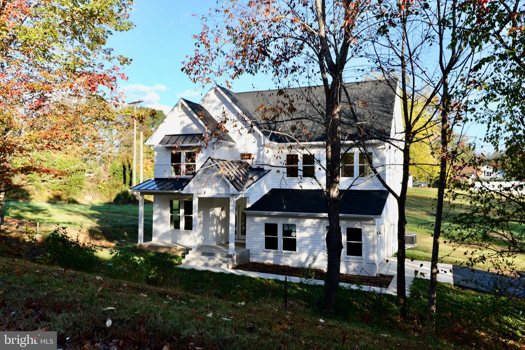 8028 Pinnacle Ridge Drive Manassas, VA 20112 - Photo 1 of 74 front view of a house with a yard