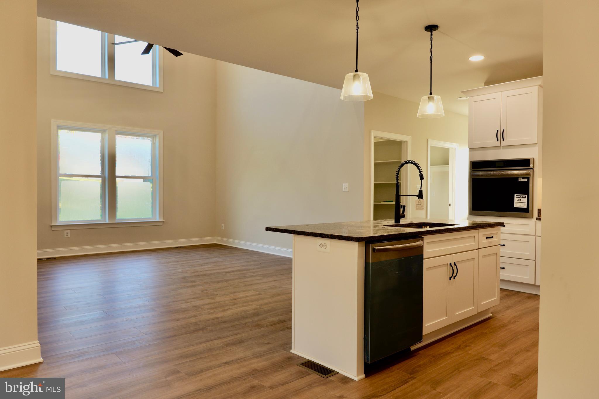 8028 Pinnacle Ridge Drive Manassas, VA 20112 - Photo 15 of 74 a kitchen with stainless steel appliances granite countertop a stove a sink and a refrigerator