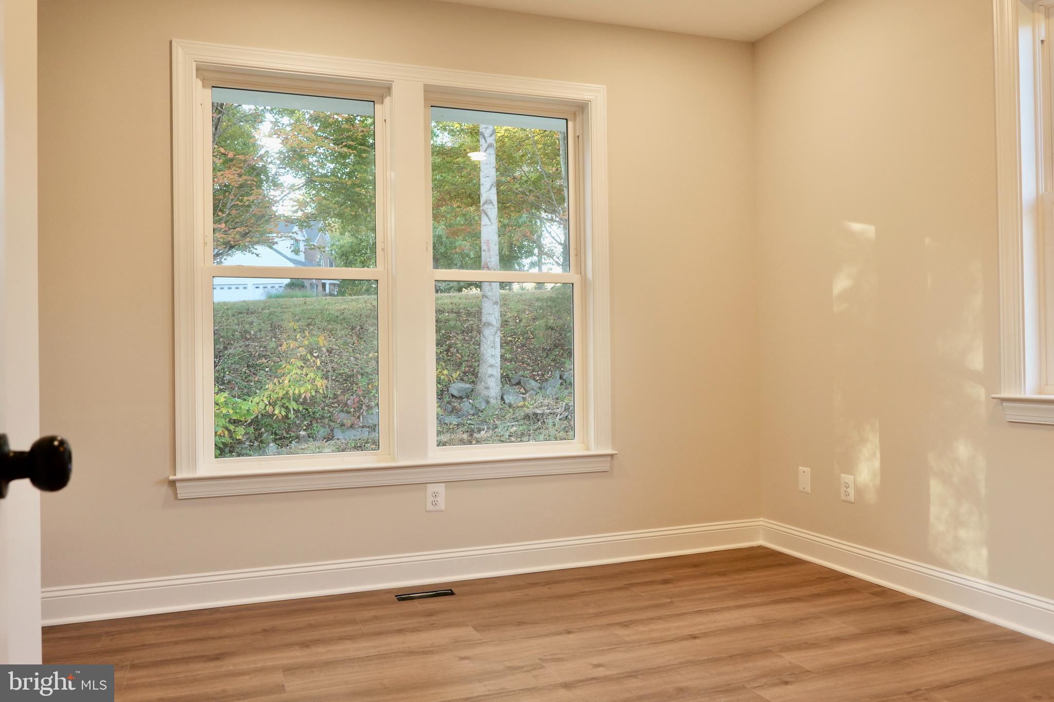 8028 Pinnacle Ridge Drive Manassas, VA 20112 - Photo 20 of 74 an empty room with wooden floor and windows