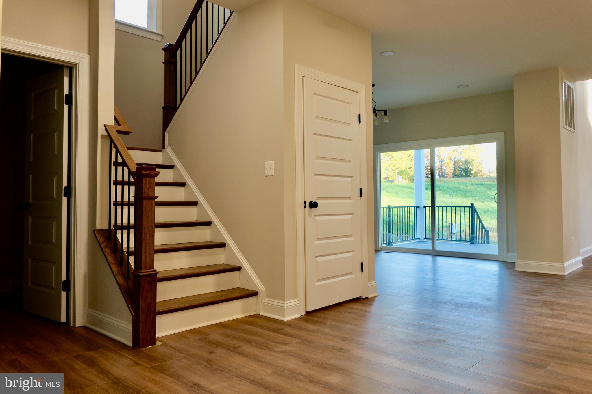 8028 Pinnacle Ridge Drive Manassas, VA 20112 - Photo 24 of 74 a view of a hallway with wooden floor and entryway