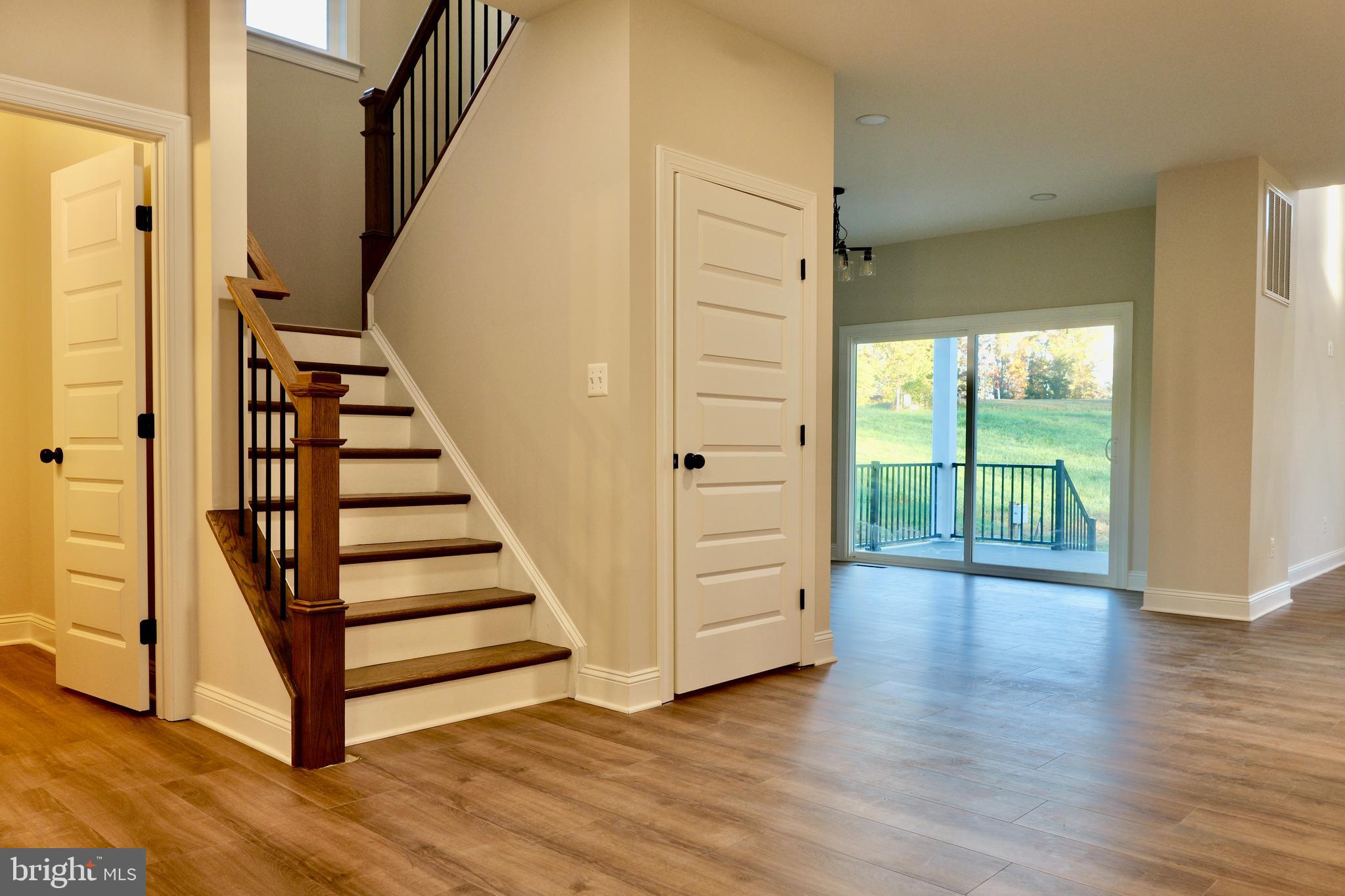 8028 Pinnacle Ridge Drive Manassas, VA 20112 - Photo 25 of 74 a view of a hallway with wooden floor and entryway