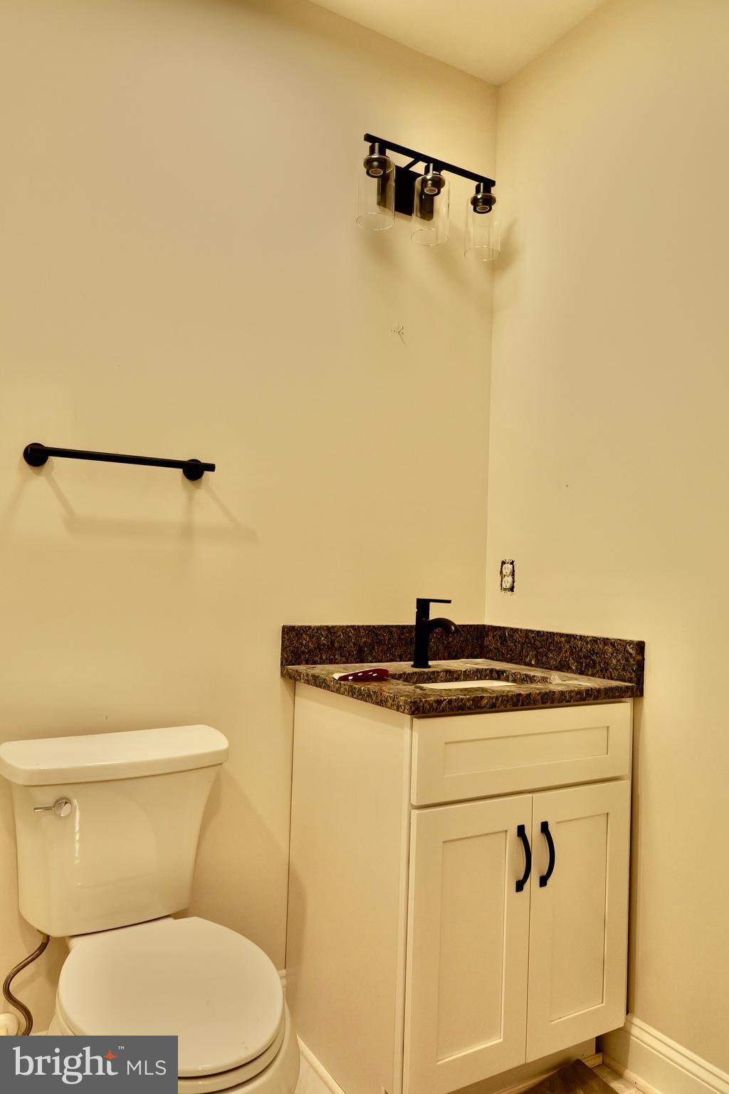 8028 Pinnacle Ridge Drive Manassas, VA 20112 - Photo 28 of 74 a bathroom with a stove a sink and a toilet