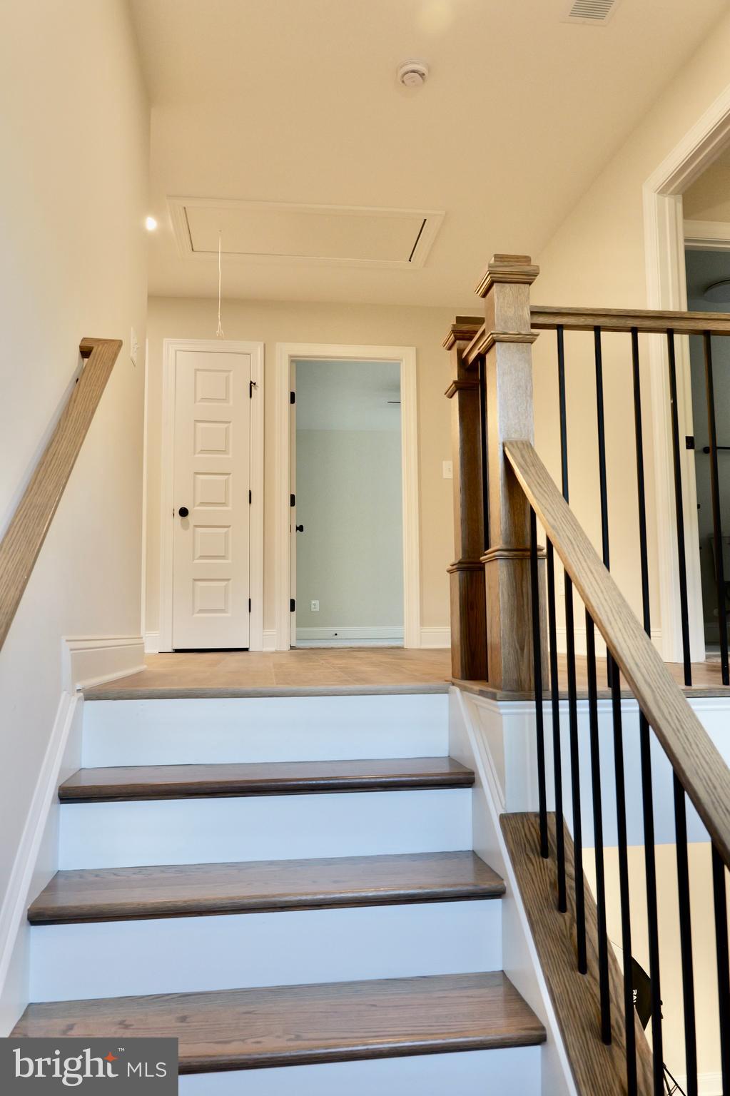 8028 Pinnacle Ridge Drive Manassas, VA 20112 - Photo 30 of 74 a view of staircase with lots of frames on wall and a window