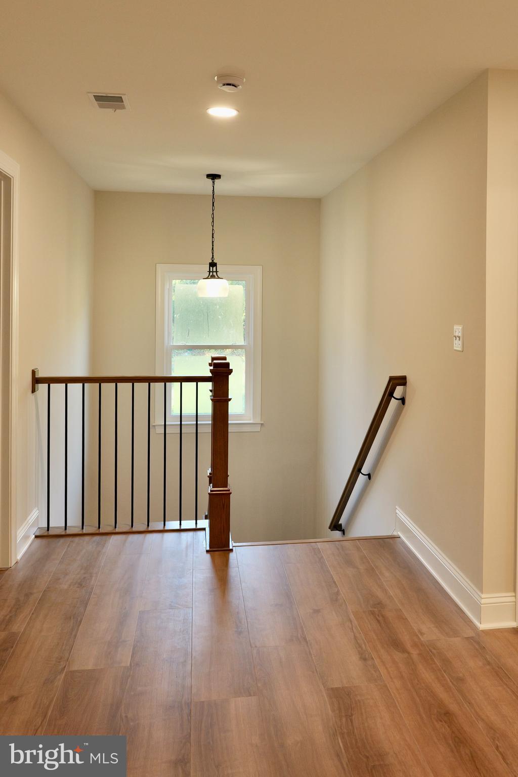 8028 Pinnacle Ridge Drive Manassas, VA 20112 - Photo 31 of 74 a view of a hallway with wooden floor