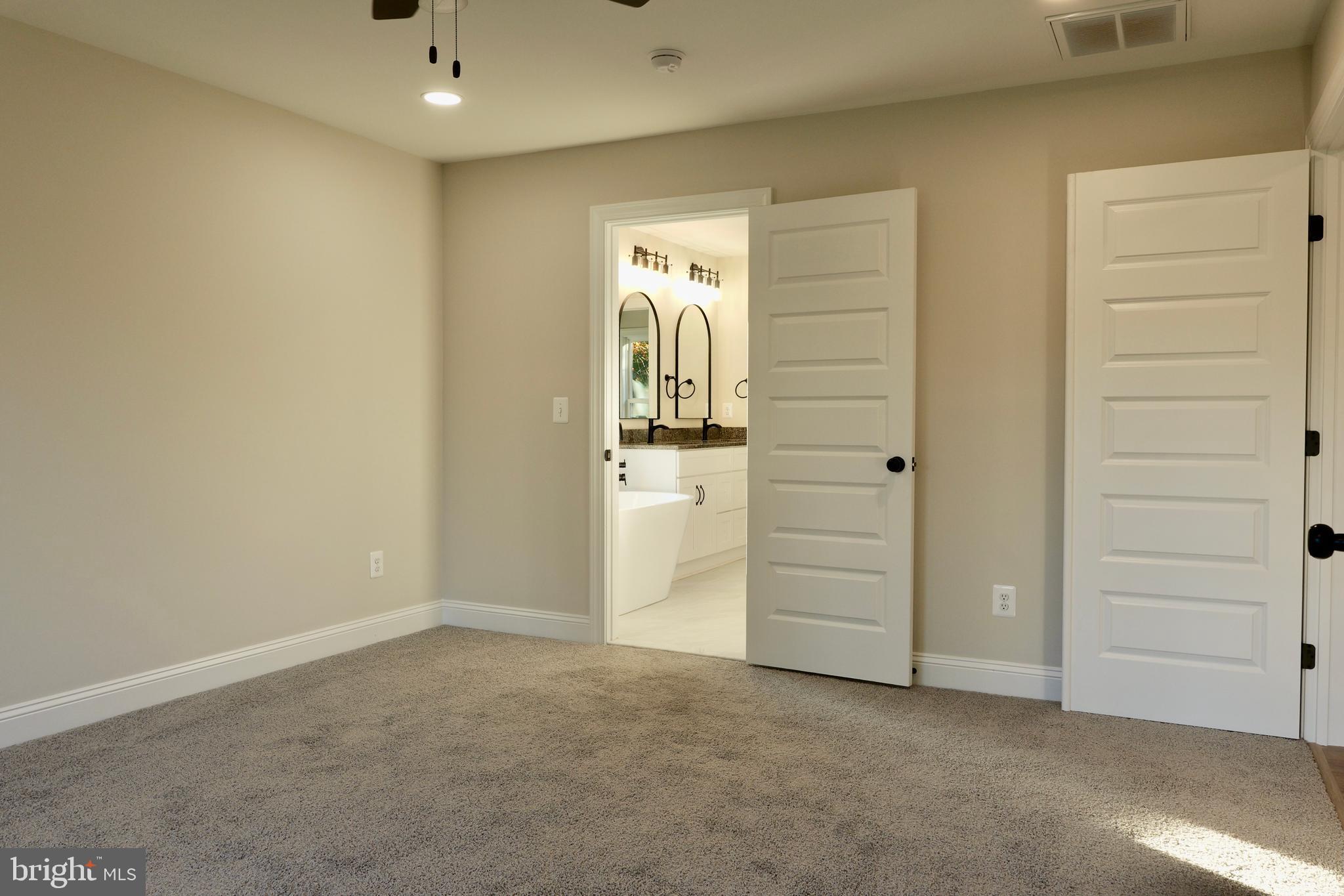 8028 Pinnacle Ridge Drive Manassas, VA 20112 - Photo 35 of 74 an empty room with closet and mirror