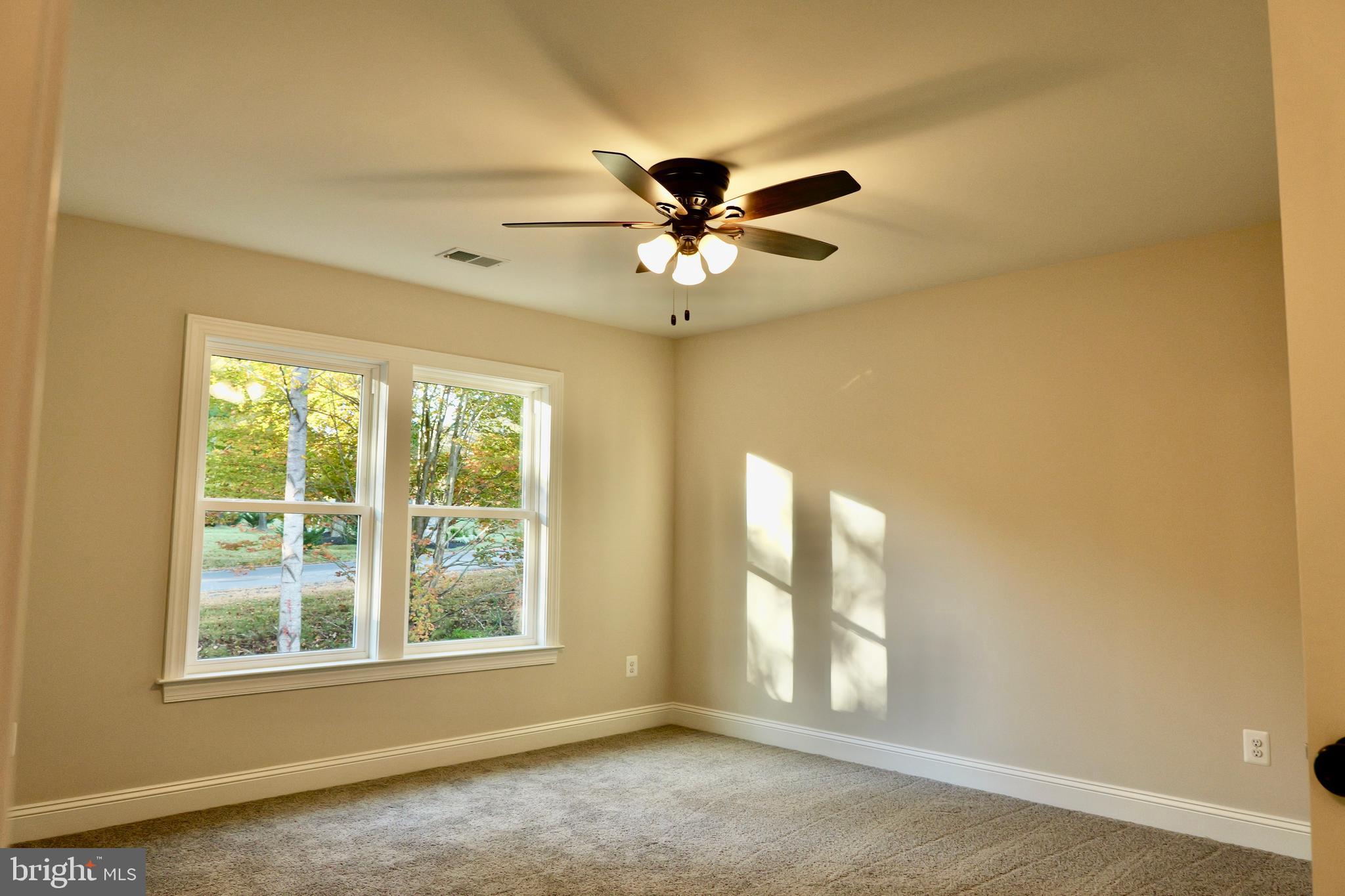 8028 Pinnacle Ridge Drive Manassas, VA 20112 - Photo 48 of 74 an empty room with windows and fan