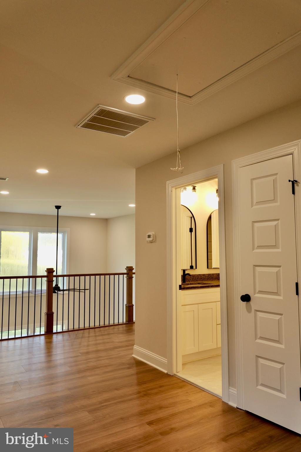 8028 Pinnacle Ridge Drive Manassas, VA 20112 - Photo 60 of 74 a view of a hallway with wooden floor