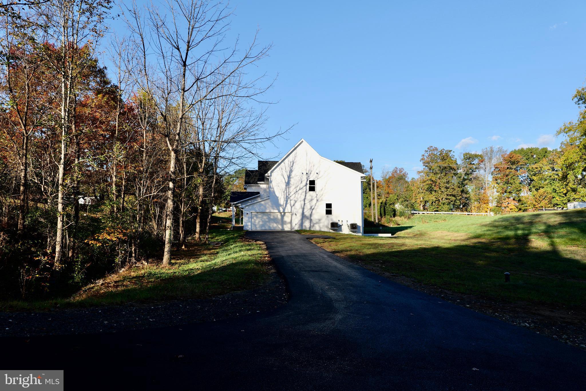 8028 Pinnacle Ridge Drive Manassas, VA 20112 - Photo 10 of 74 a view of swimming pool and trees