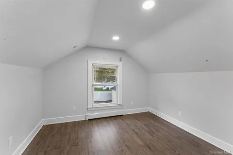 a view of wooden floor and chandelier in a room