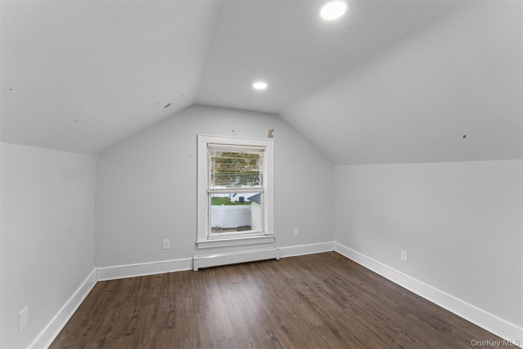 242 Bayview Drive Mastic Beach, NY 11951 - Photo 11 of 18 a view of wooden floor and chandelier in a room