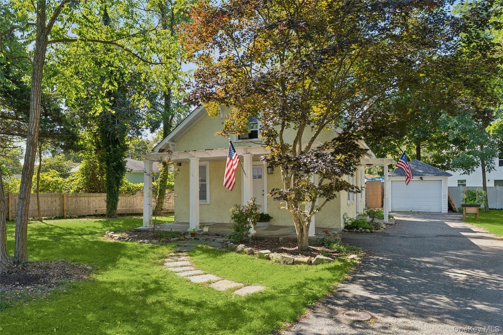 242 Bayview Drive Mastic Beach, NY 11951 - Photo 17 of 18 a front view of house with yard