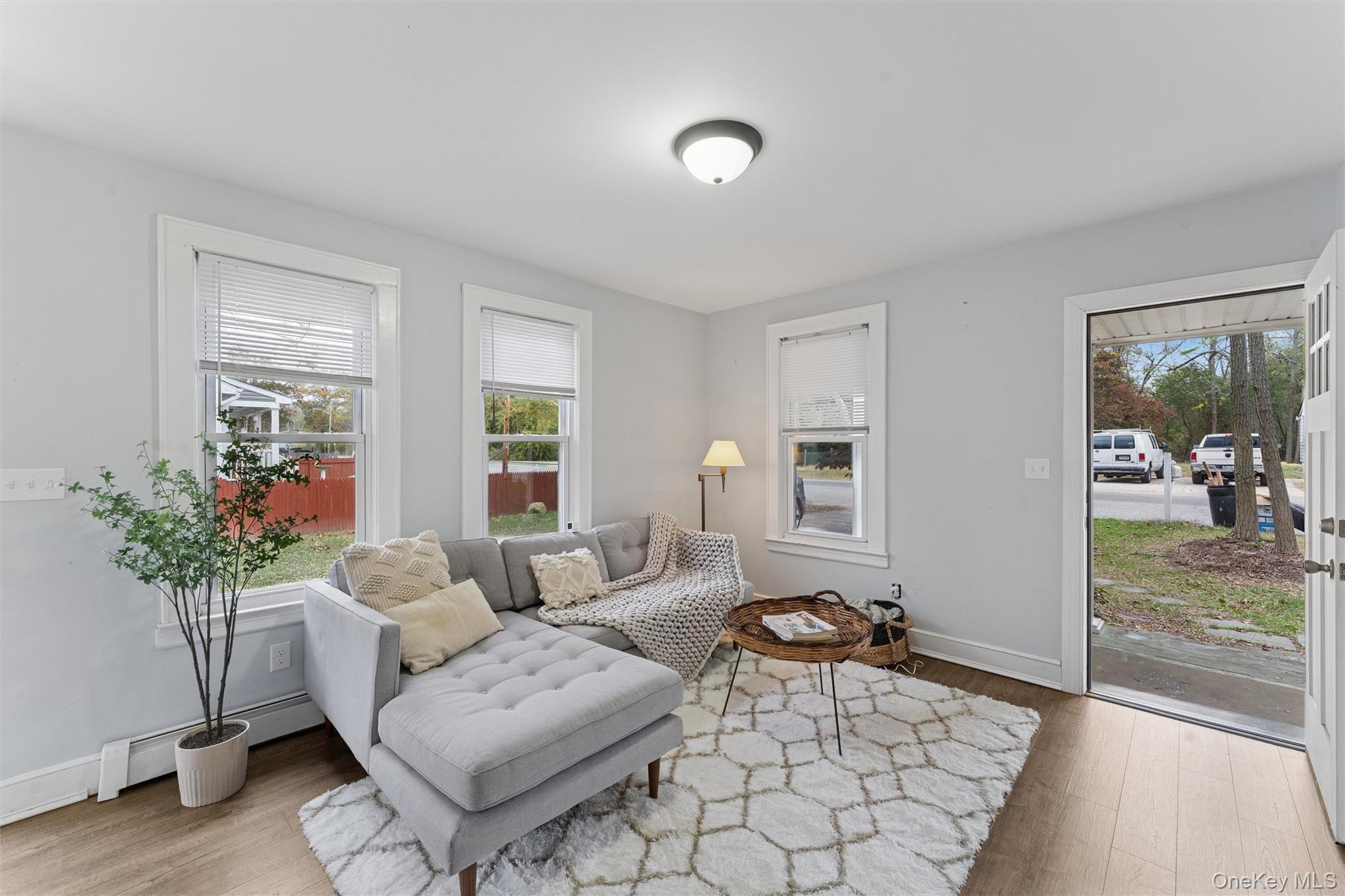 242 Bayview Drive Mastic Beach, NY 11951 - Photo 2 of 18 a living room with furniture and a potted plant