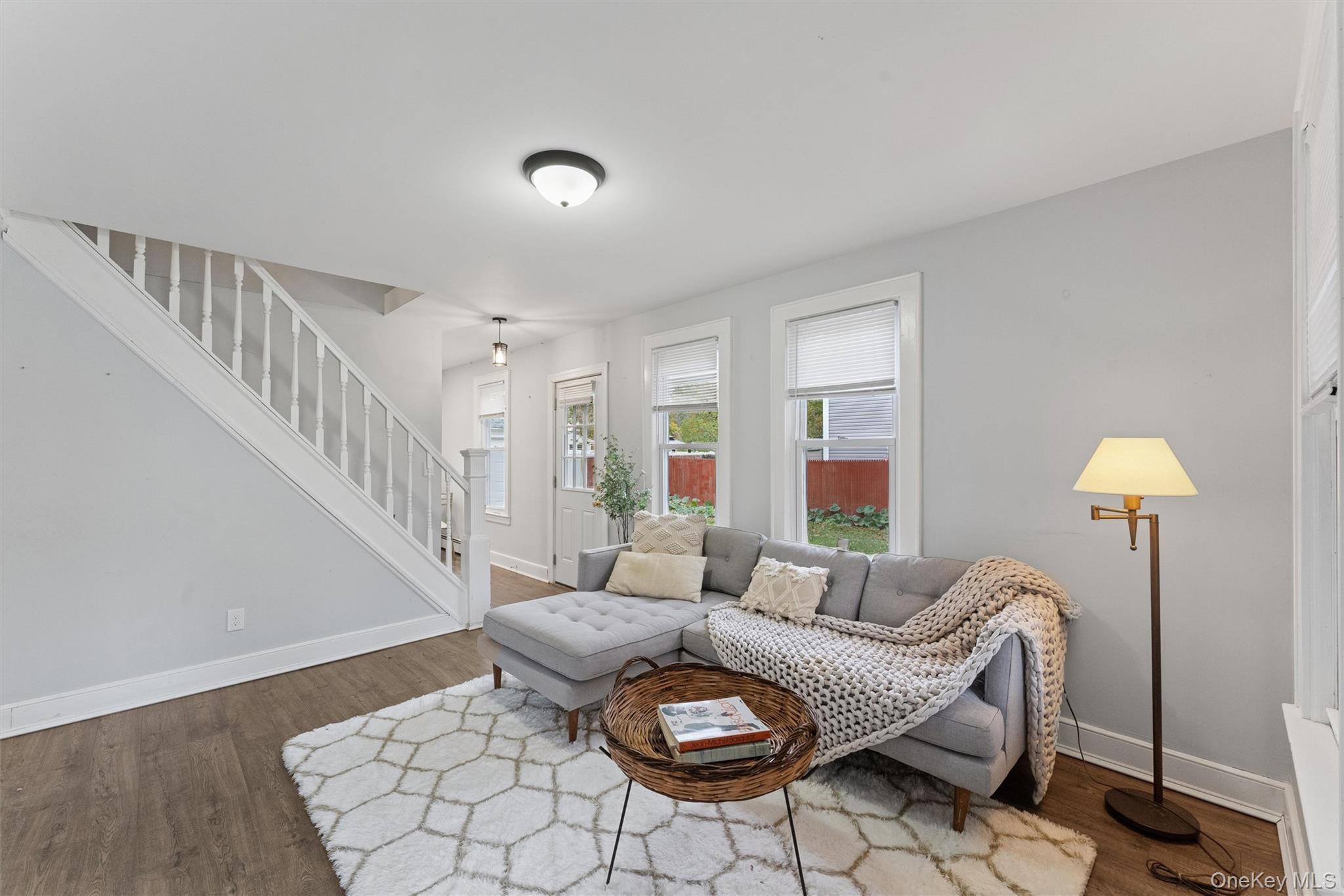 242 Bayview Drive Mastic Beach, NY 11951 - Photo 3 of 18 a living room with furniture and a lamp