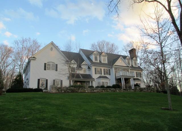 32 Springbrook Lane Wilton, CT 06897 - Photo 1 of 1 a view of a house with a big yard and large trees
