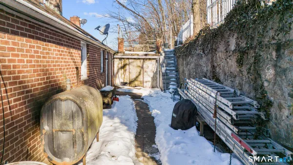 a view of roof deck with wooden floor and outdoor seating