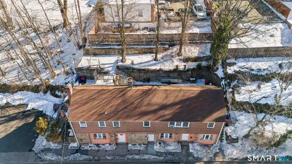 a view of a yard with wooden fence