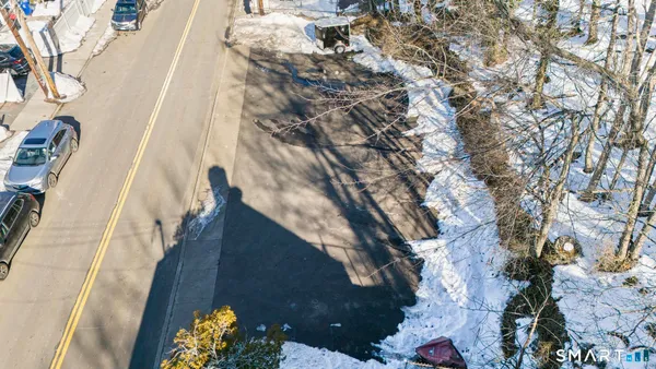 a view of a street with a building in the background