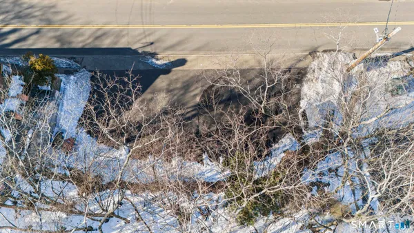 a bathroom with a tub a sink a mirror and a shower