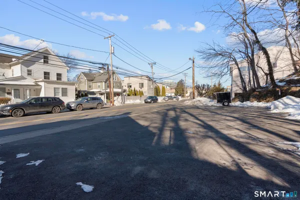 a view of a street with cars