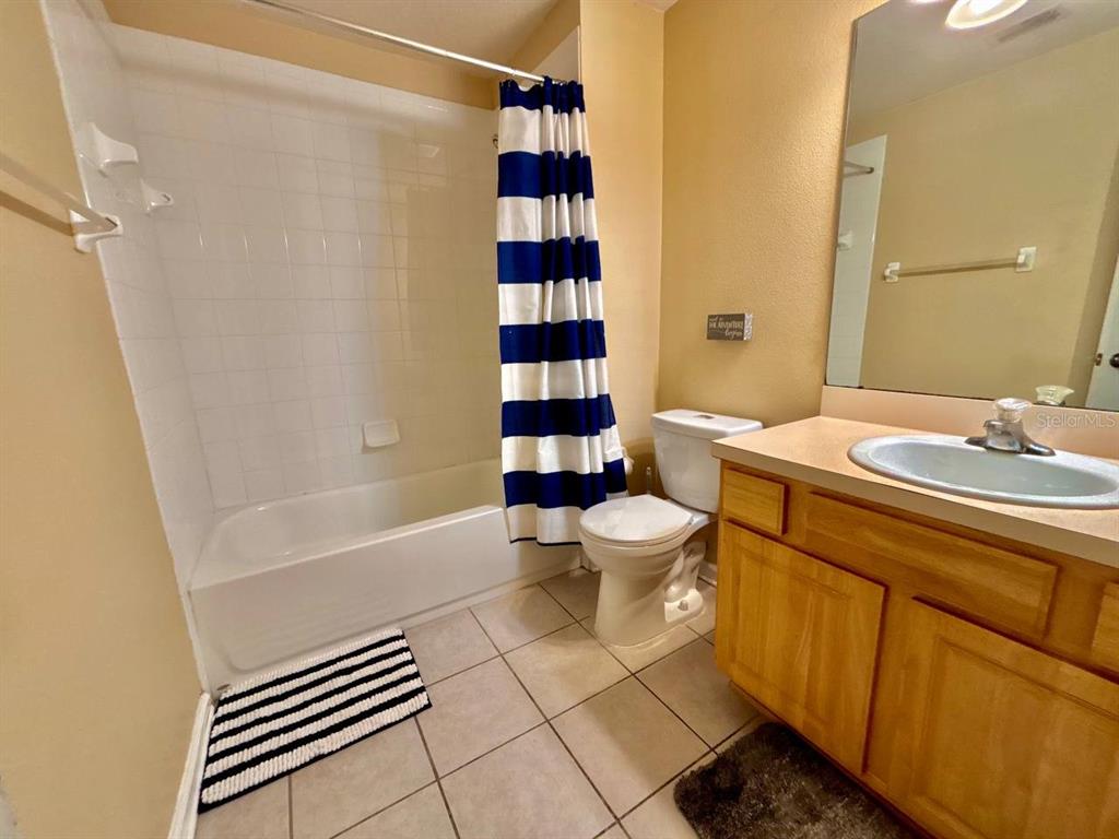 26618 Castleview Way Wesley Chapel, FL 33544 - Photo 15 of 29 a bathroom with a sink a toilet and shower