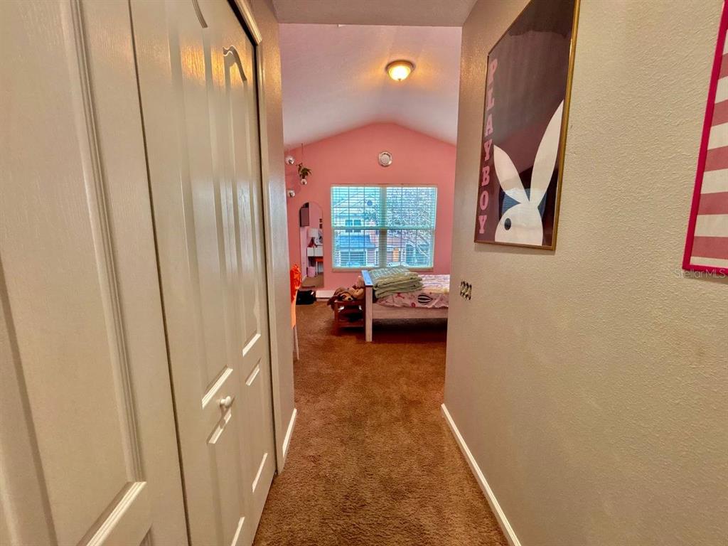 26618 Castleview Way Wesley Chapel, FL 33544 - Photo 16 of 29 a view of a bedroom from a hallway
