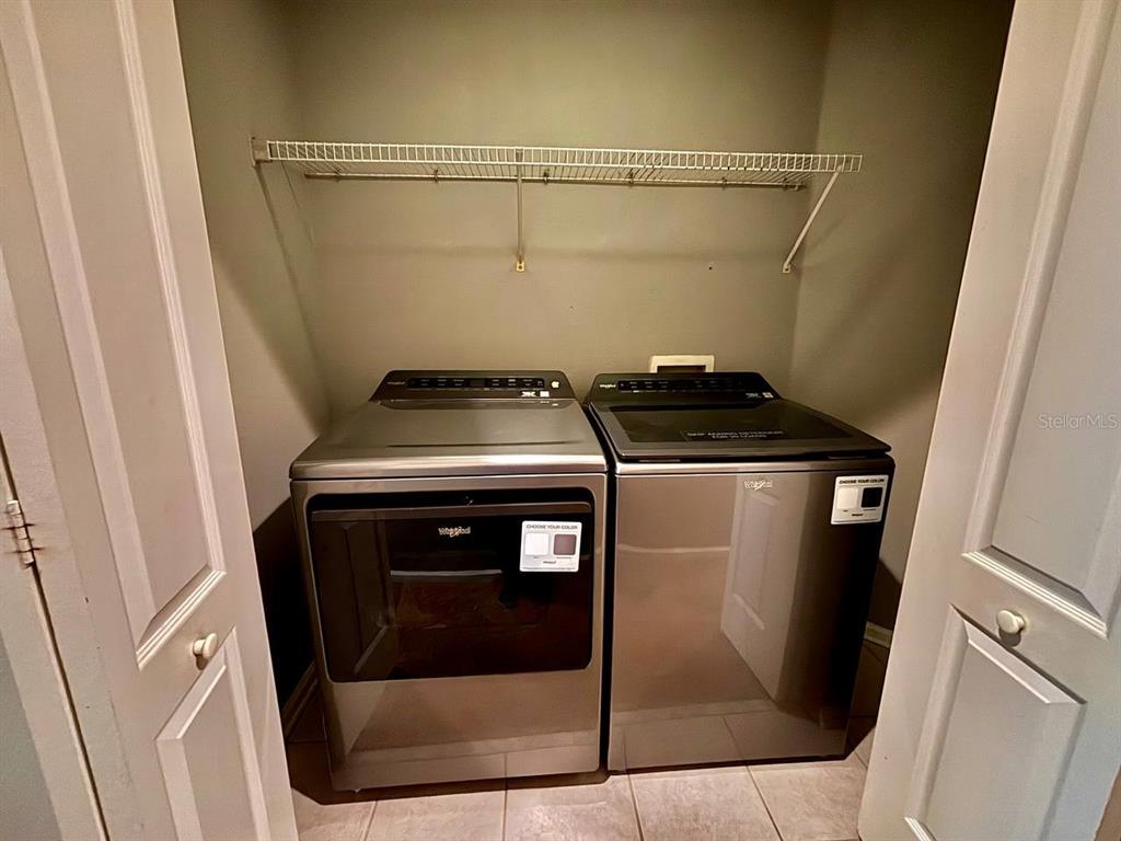 26618 Castleview Way Wesley Chapel, FL 33544 - Photo 19 of 29 a utility room with dryer and washer